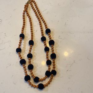 J. Crew wooden and navy Pom Pom necklace